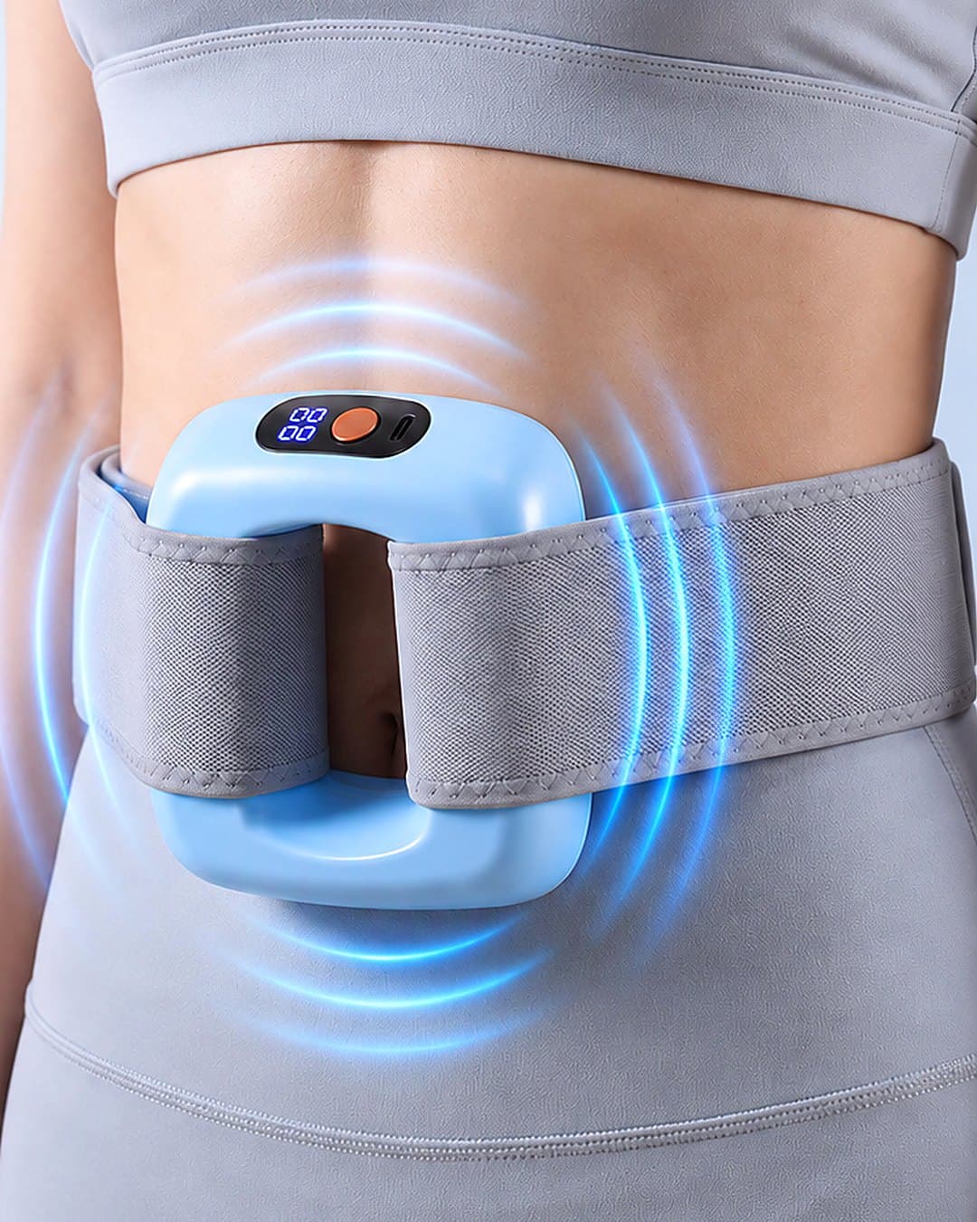 Le masseur en anneau fixé à la taille avec sa ceinture grise réglable
